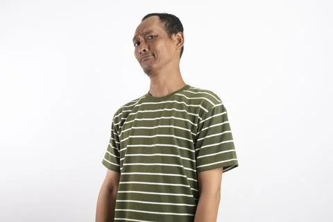 Studio portrait of a skeptical man with a doubtful facial expression, looki.. Stock Photos