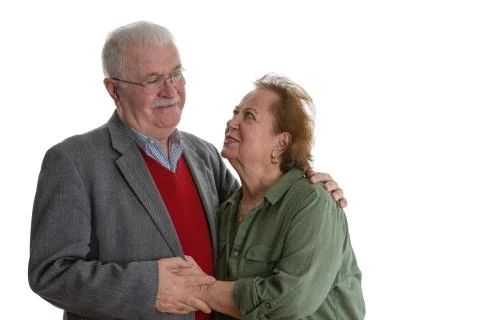 Studio portrait of smiling elderly couple Stock Photos
