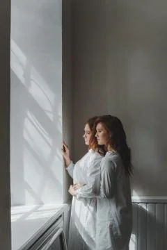 Studio portrait of two red-haired twin girls. Stock Photos