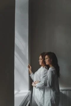 Studio portrait of two red-haired twin girls. Stock Photos