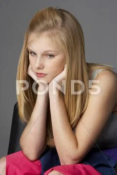 Studio portrait of unhappy teenage girl Stock Photos