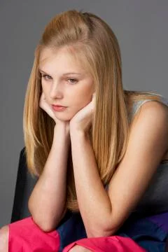 Studio portrait of unhappy teenage girl Stock Photos