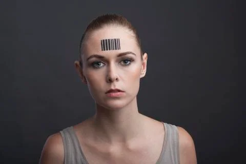 Studio portrait of woman with bar code on forehead Stock-Fotos