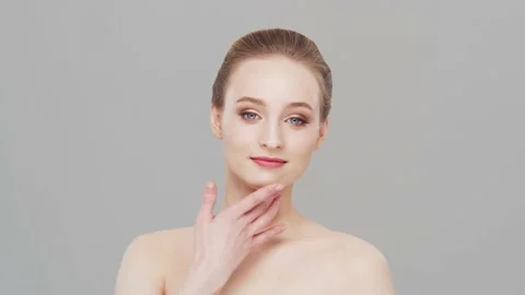 Studio portrait of young, beautiful and natural woman. Face lifting, cosmetics Stock Footage 152165182