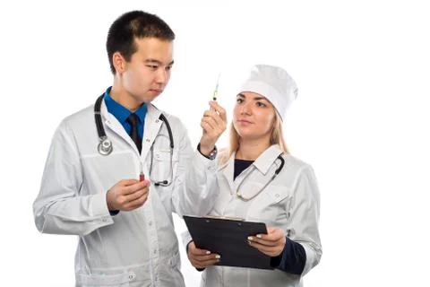 Studio portrait of young doctors in uniform Stock Photos