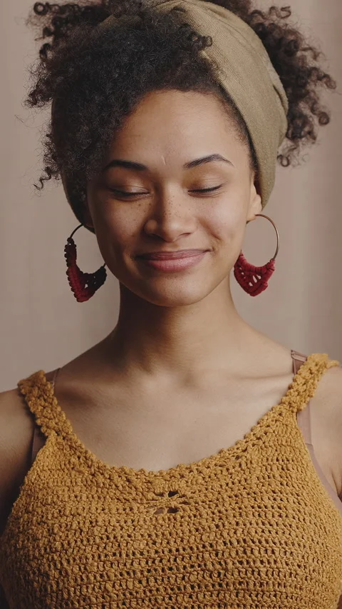 Studio portrait of young stylish african american lady smiling to camera Stock Footage 328608599