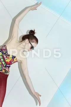 Studio portrait of a young woman in sunglasses Stock Photos
