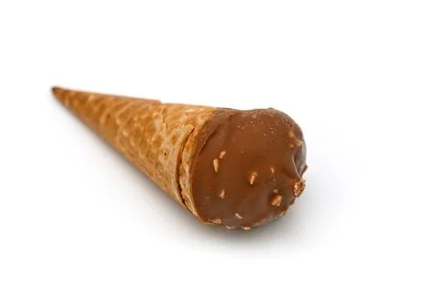 Studio product shot of a single chocolate and nut-coated ice cream cone iso.. Foto stock