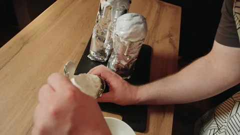 Studio scene of pastry chef applying shiny coating carefully Video stock 330537175