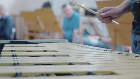 Studio scene with vibraphone and performers, closeup of mallets hitting metal Video stock 322116135