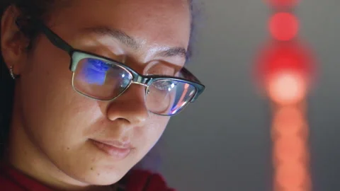 Studio session capturing city lights and focused editing expression. Closeup of Stock Footage 338095872