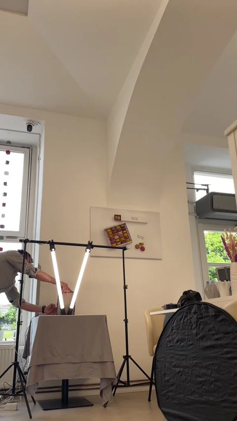 Studio setup preparations. Adjusting lighting and props carefully Video stock 335358914