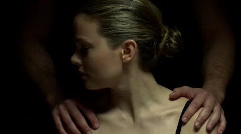 Studio shoot with man standing behind a woman in color Stock Footage 22955107