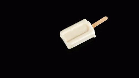 Studio shoot of milk popsicle melting on black time lapse 8K resolution Stock Footage 90581887
