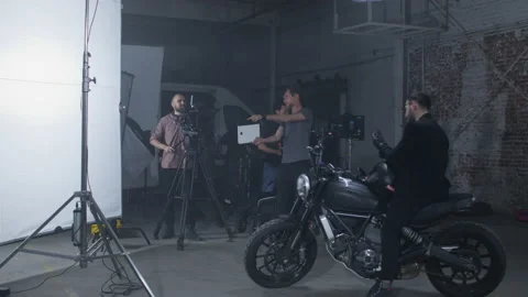 Studio shooting against white background as seen from the backstage Stock Footage 198270974