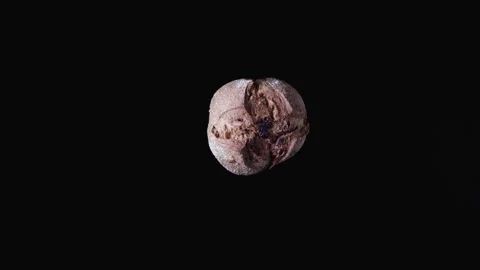 Studio shooting of freshly baked rye bread on a black background Stock Footage 143070748