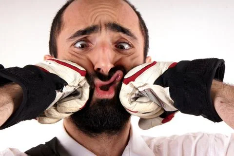 Studio shot of a beard man hit from by punches Stock Photos