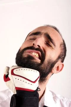 Studio shot of a beard man hit from by punches Stock Photos