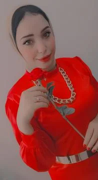 Studio shot of a beautiful middle eastern young girl wearing hijab and red dress Stock-Fotos
