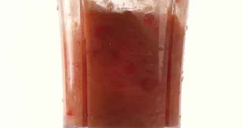 Studio shot of Blending tomatoes in blender Stock Footage 162588298