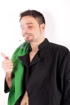 Studio shot of a boy with chef clothes smoking cigarette Stock Photos