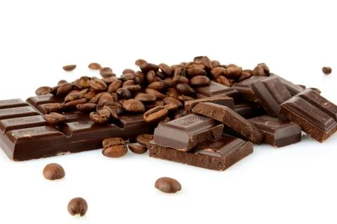 Studio shot of chocolates and beans of coffee isolated on white background Stock Photos