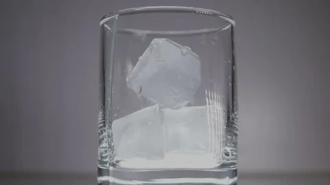 Studio shot of Cola pouring into transparent glass on white table. Stock Footage 148543878