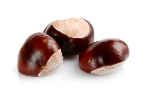 Studio shot of few chestnuts with shell isolated on white background Stock Photos