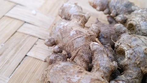 Studio Shot of Fresh Red Ginger Roots on Bamboo Mat Stock Footage 340619058