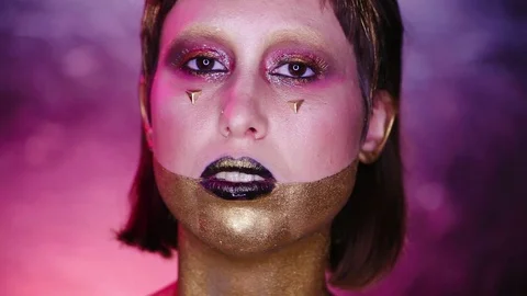 Studio Shot of a Golden Glittery Body Woman Stock Footage