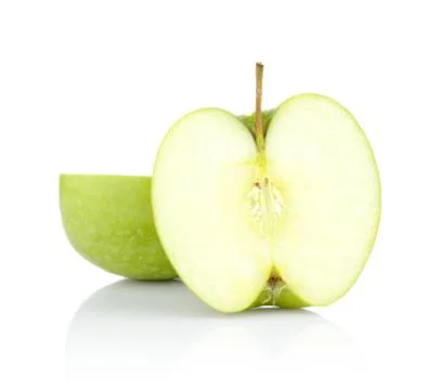 Studio shot of green apple slice in half isolated white background Stock Photos
