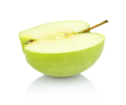 Studio shot of green apple slice in half isolated white background Stock Photos