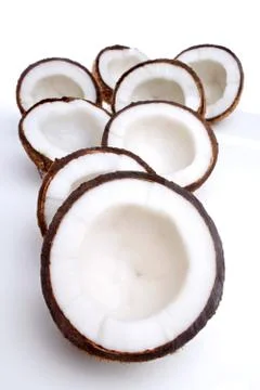 Studio shot of halved coconuts Stock Photos
