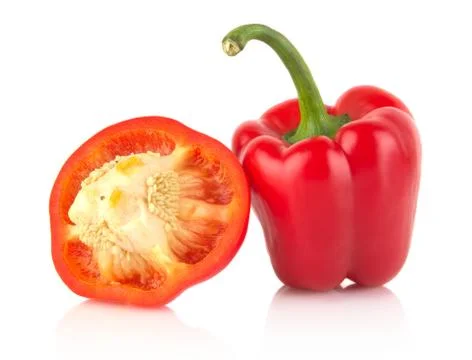 Studio shot of halved red bell peppers isolated on white background Stock Photos