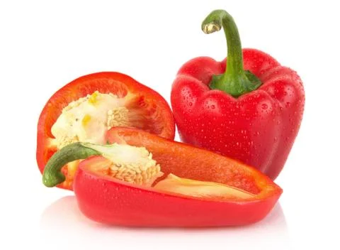 Studio shot of halved red bell peppers isolated on white background Stock Photos