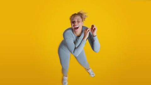 Studio Shot Looking Down On Woman In Gym Clothes Exercising And Dancing On Stock Footage 259431731