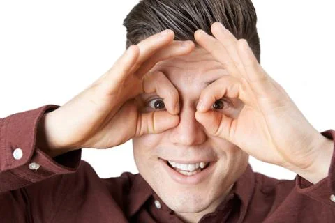 Studio Shot Of Man Making Spectacle Shape With His Hands Stock Photos