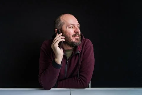 Studio shot of man talking on mobile phone Stock Photos