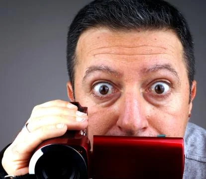 Studio shot of a man with a video camera Stock Photos