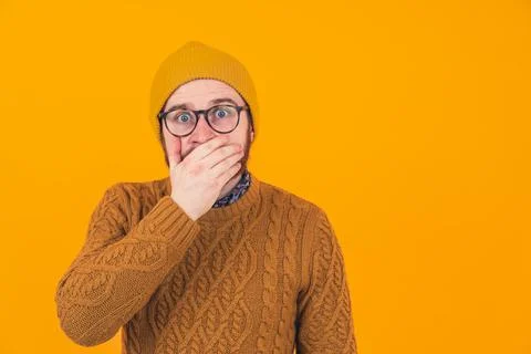 Studio shot on orange background of an isolated shocked scared surprised Stock Photos