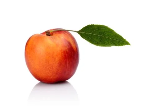 Studio shot of orange nectarine with leaf isolated on white background Stock Photos