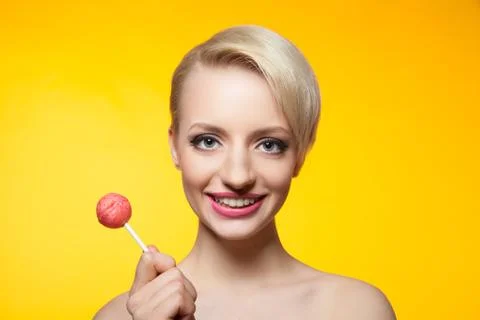 Studio shot of pretty model with bright chupa Stock Photos