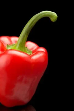 Studio shot of red bell pepper isolated on black background Stock Photos