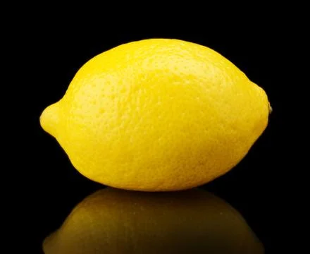 Studio shot of single lemon isolated on black background Stock Photos