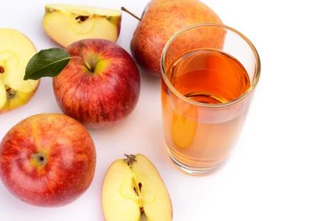 Studio shot of sliced red apple with leaf and apple juice isolated on a white Stock Photos