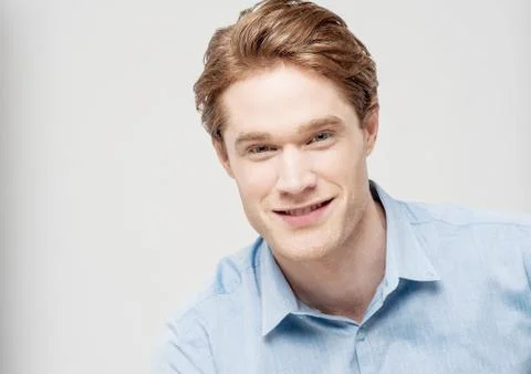 Studio shot of smart young guy Stock Photos