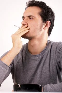 Studio shot of a smoking man Stock Photos