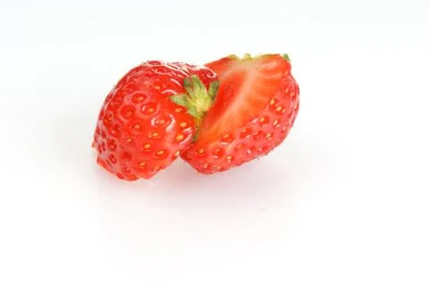 Studio shot of a strawberry cut in half  Stock Photos