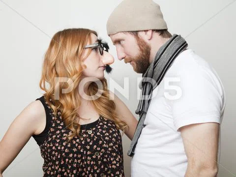 Studio Shot of three people dressed up in animal noses and sombrero Stock Photos