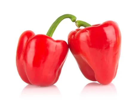 Studio shot of two red bell peppers isolated on white background Stock Photos